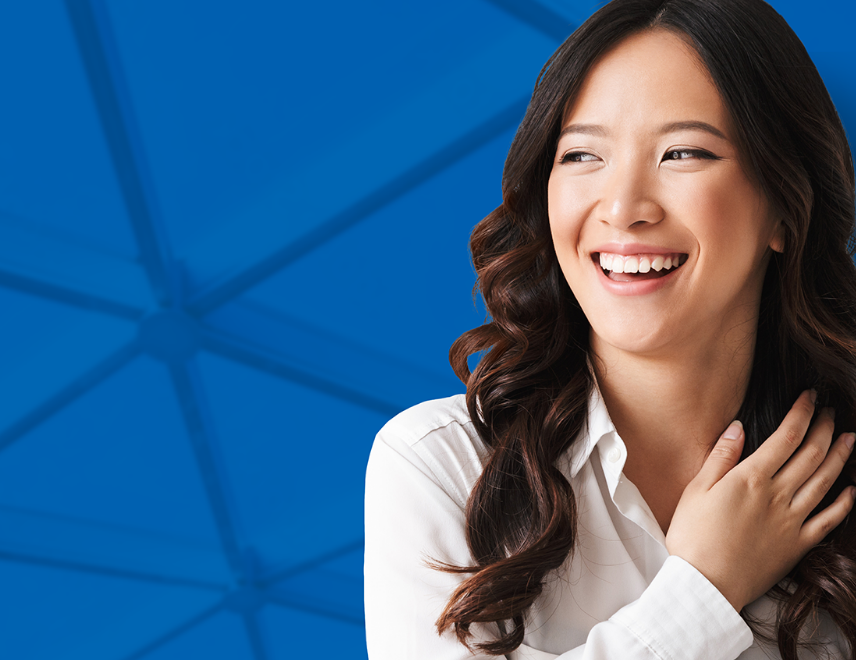 Smiling young woman, holding her hair.