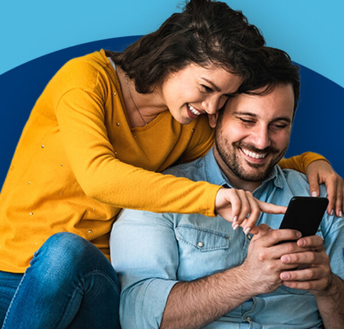Happy couple using smartphone engaging with online financial services from a trusted provider.