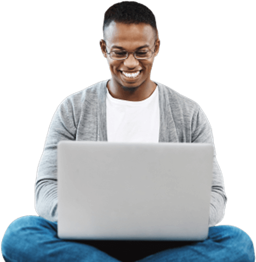 Smiling man using laptop, representing Moneytree’s commitment to accessible, customer-focused financial services.
